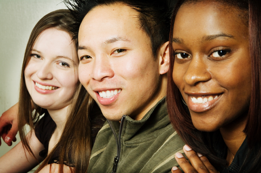 Three teens smile