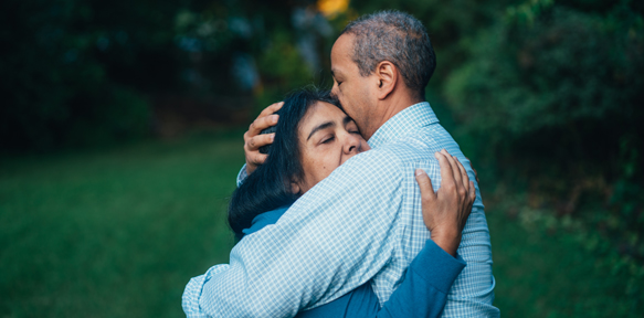 man and woman hugging