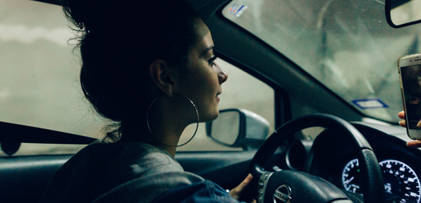 teen girl driving a car