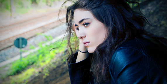 teen girl looking pensive