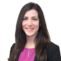 Professional headshot of a woman in business attire, smiling