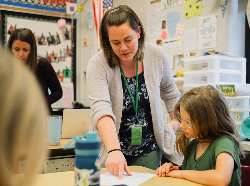 Compass Mark employee with a student