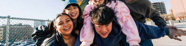 Close up of 4 teens outside, smiling